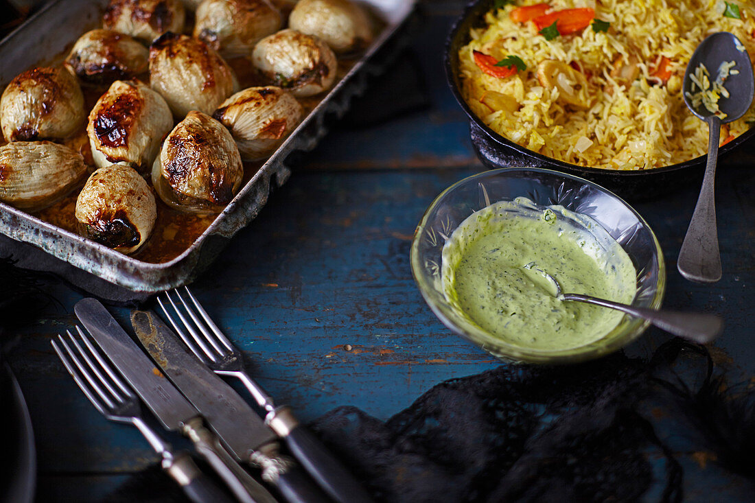 Stuffed onions, root vegetable rice and herby yogurt dressing