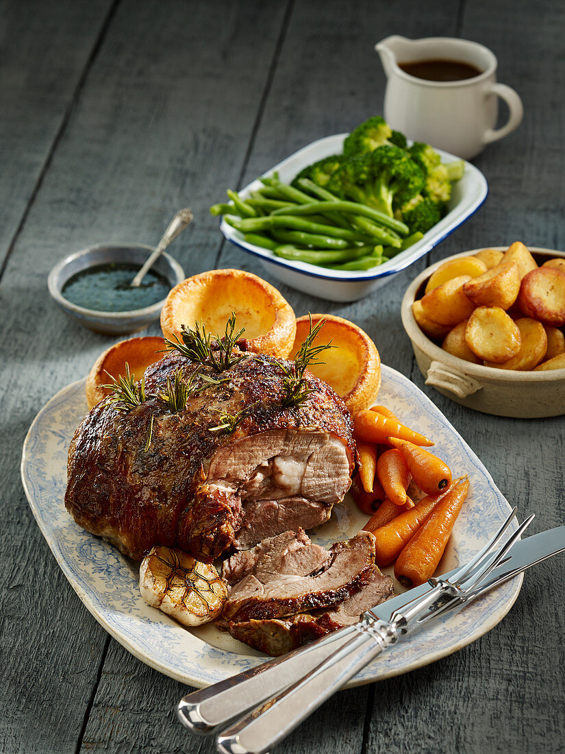 Roasted leg of lamb with Yorkshire puddings and vegetables (England)