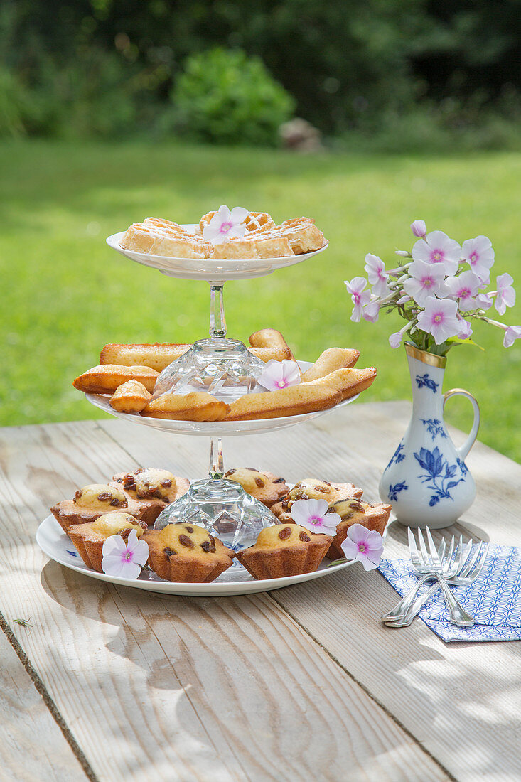 French pastries on DIY cake stand made from glasses and plates