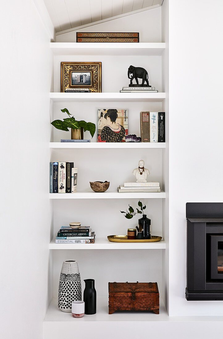 Shelves next to fireplace in living room