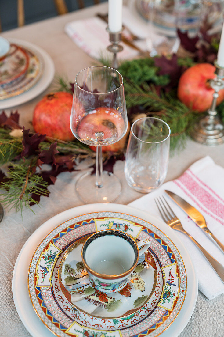 Colourful, Oriental-style crockery on festively set table