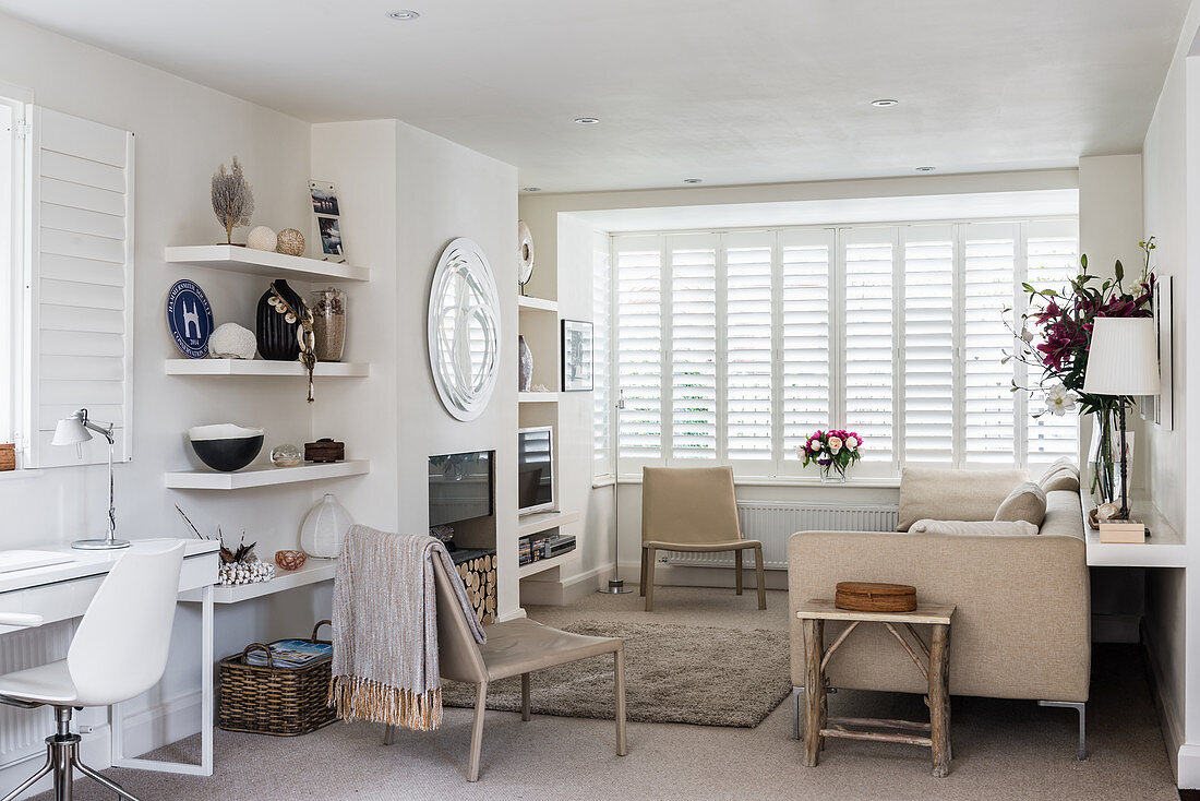 Fireplace in classic living room in white and beige