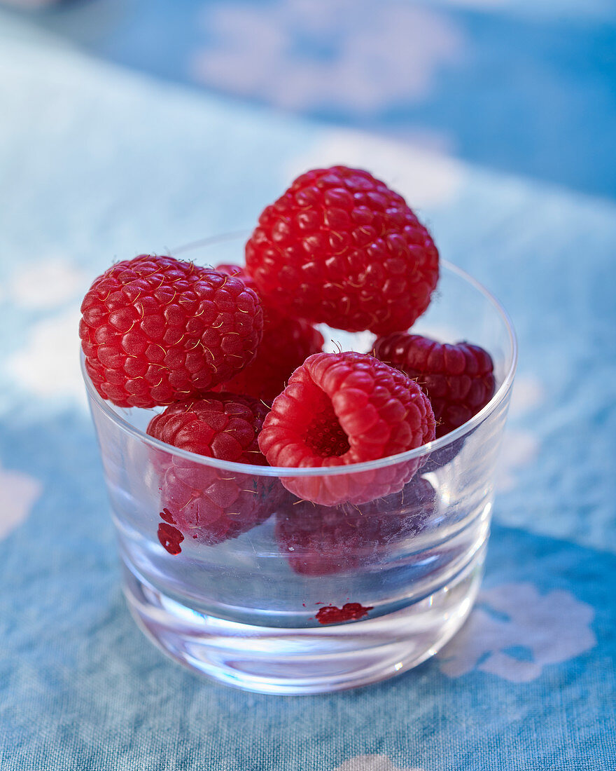 Fresh raspberries in a glass