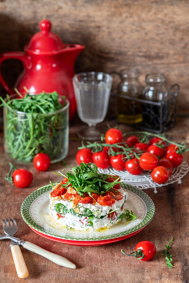 Tomato salad with roast tomatoes. cottage cheese and rocket salad