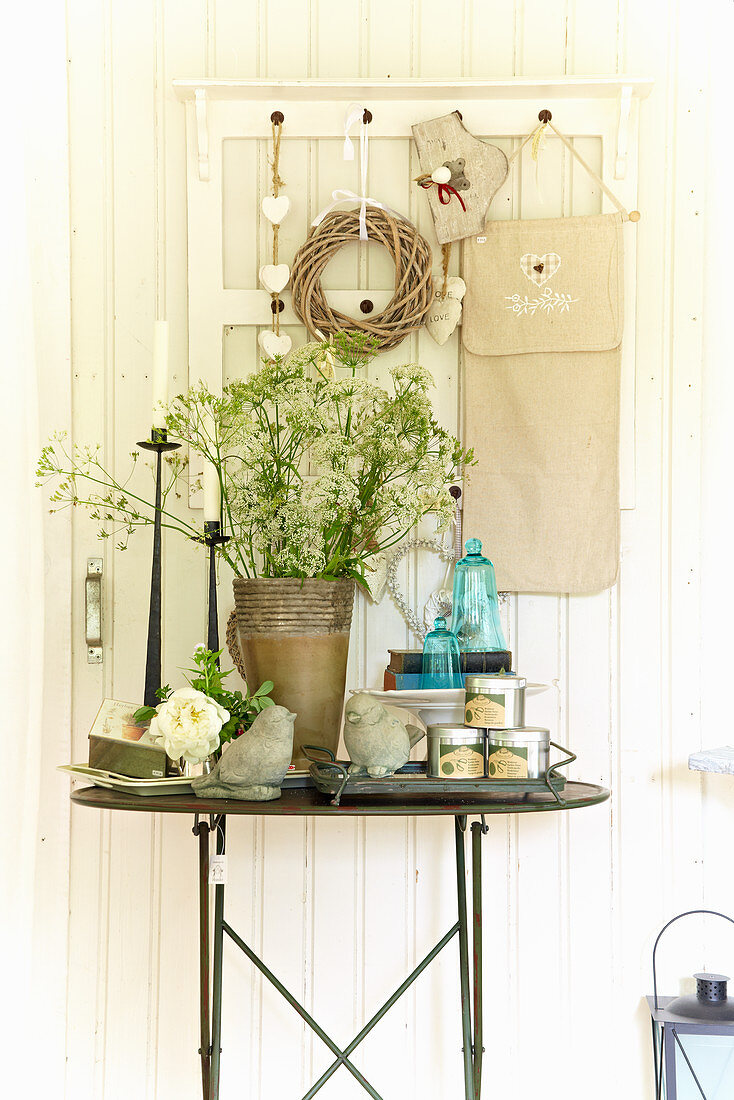 Various accessories on small table in summerhouse