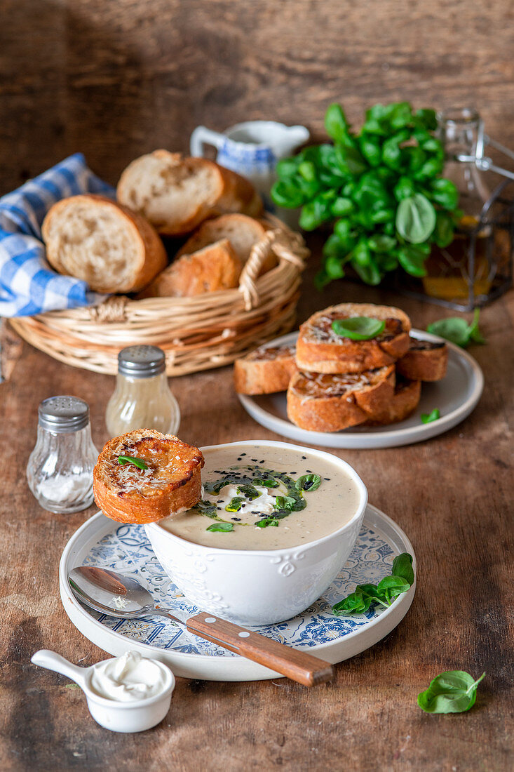 Potato cream soup with mustard baked baquette