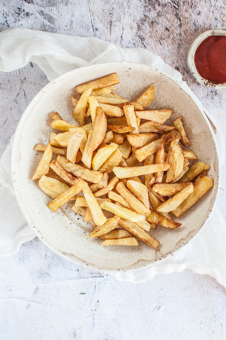 Homemade french fries served with ketchup