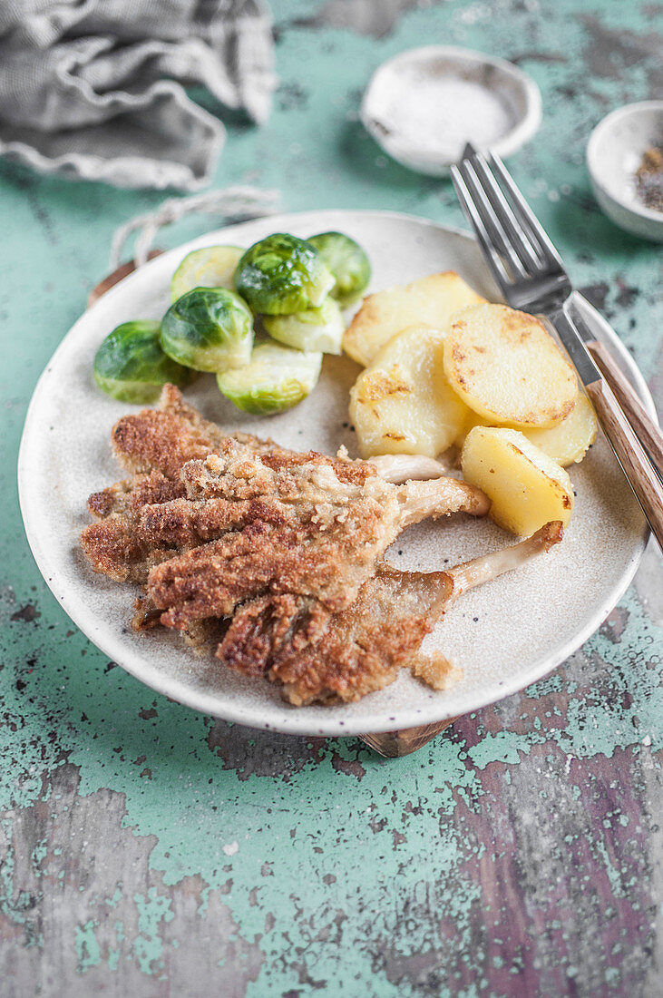 Vegan oyster mushroom 'schnitzel' served with brussles sprout and fried potatoes