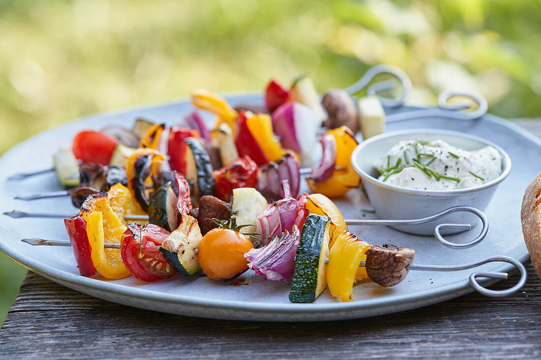 Grilled vegetable kebabs with a herb and quark dip