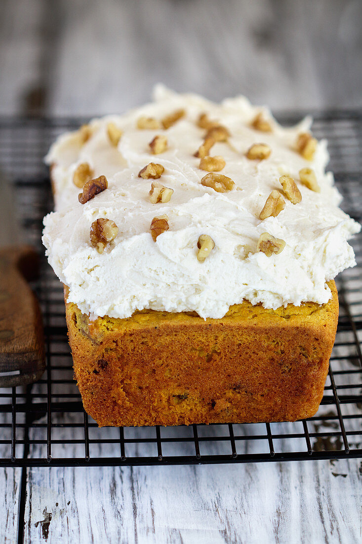 Keto Carrot Cake with almond flour and walnuts and frosted with a sugar free cream cheese frosting