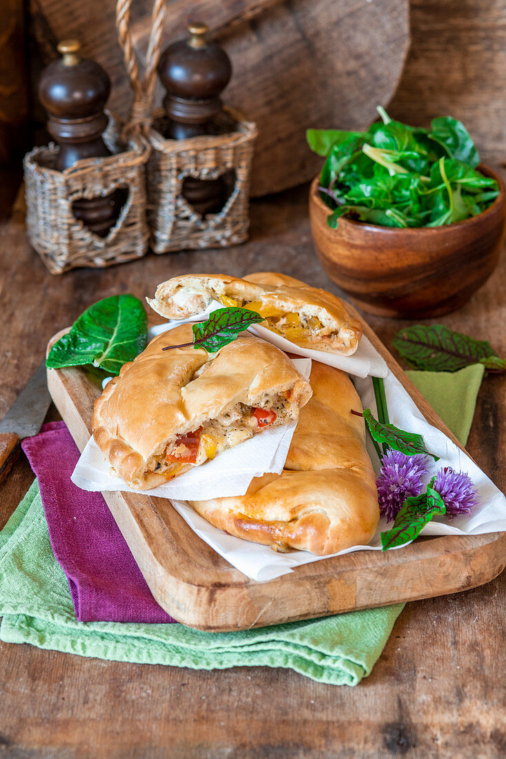 Pizza calzone with chicken and pepper