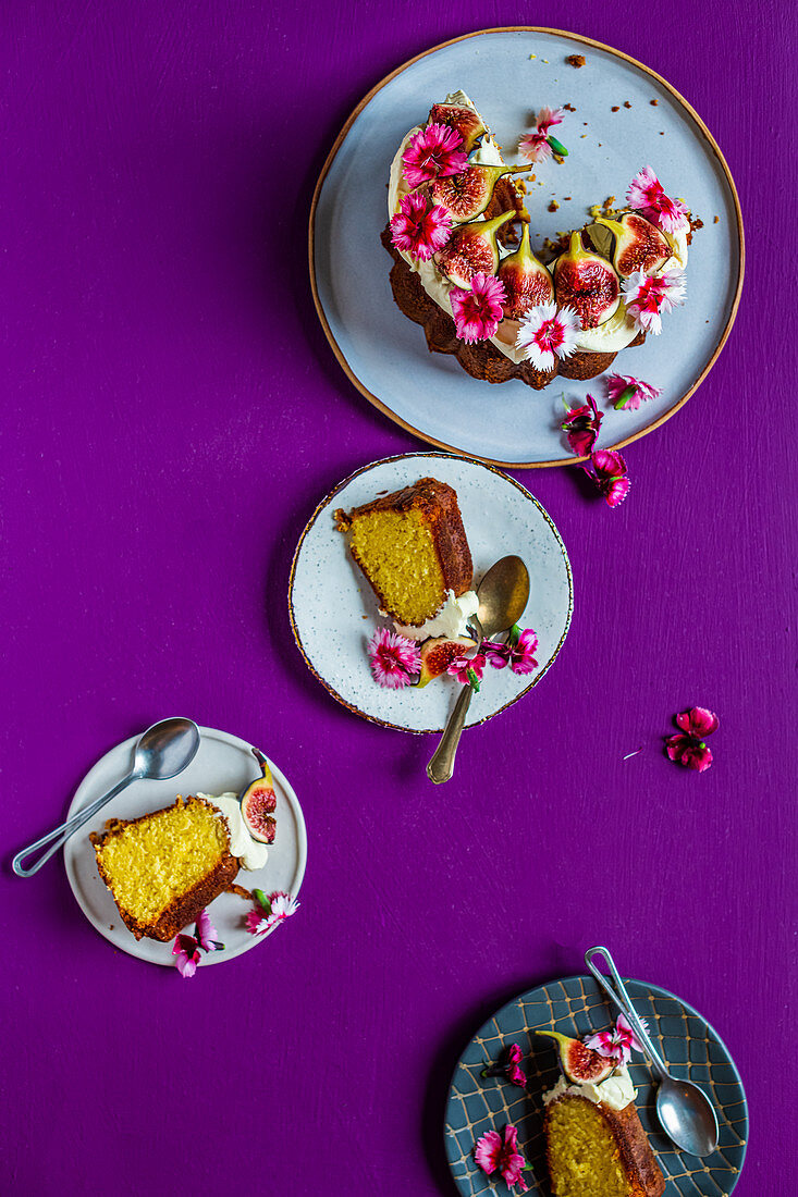 Sliced fig cake with edible flowers