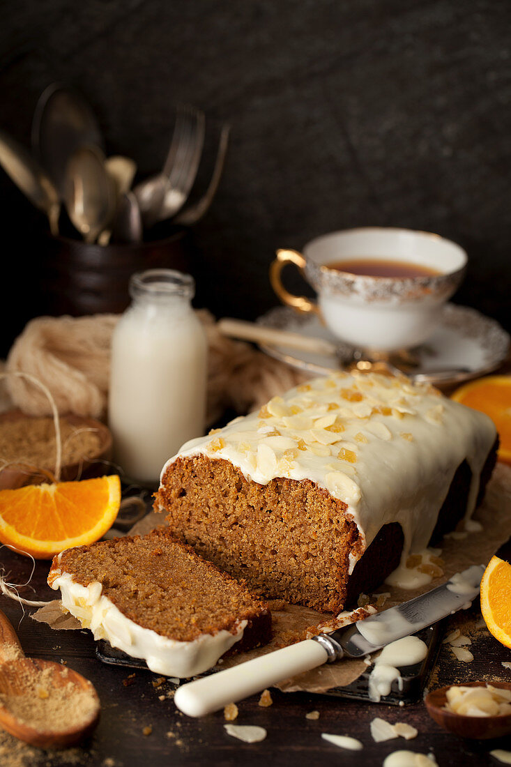 Cut into Vegan Orange and Ginger Cake with Glace Icing