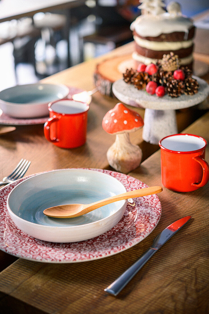 Table decorated for Christmas in rustic style with papier-mâché mushrooms