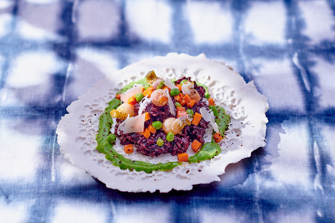 Risotto with black rice, vegetables and basil sauce