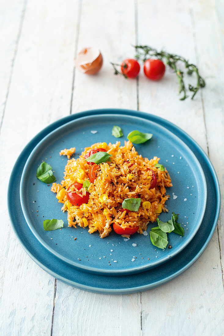 Fried rice with egg, sweetcorn, cherry tomatoes and pesto