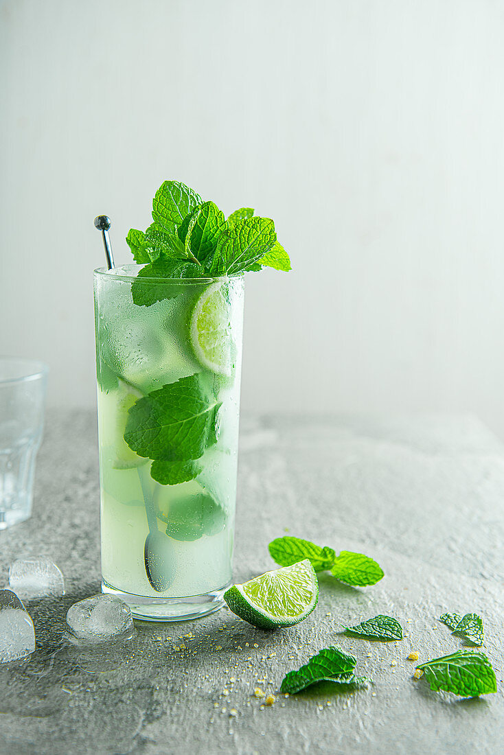 Mojito cocktail with lime, brown sugar and mint