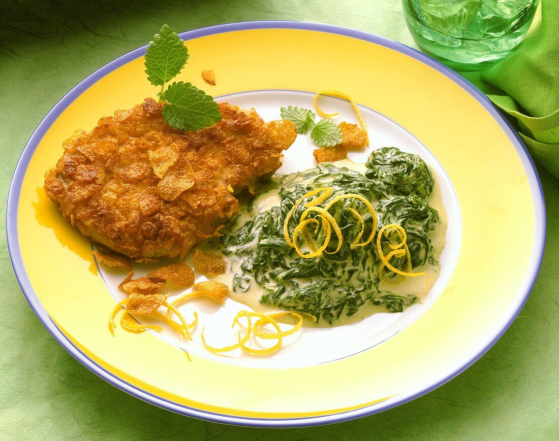 Pork escalope with cornflake crust and spinach