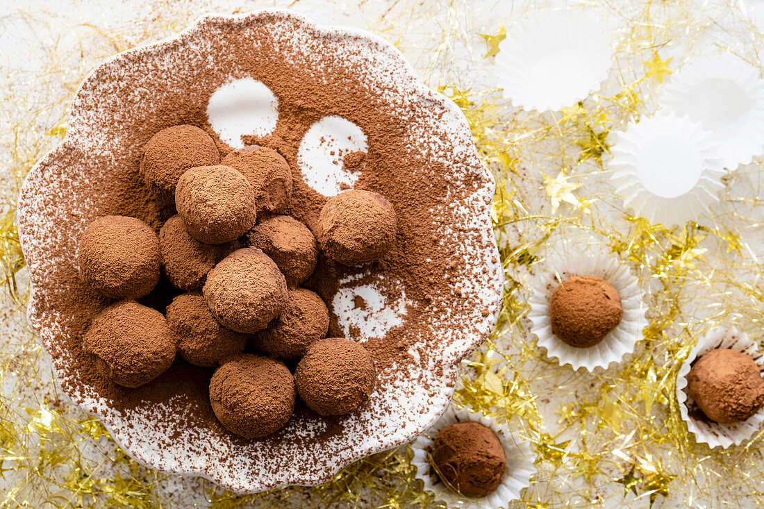 Homemade chocolate truffles coated in cocoa.