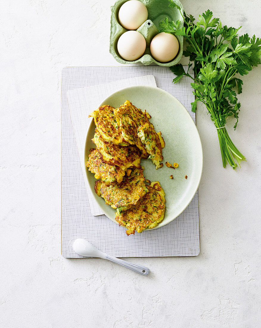 Vegetarian corn and millet fritters with gouda