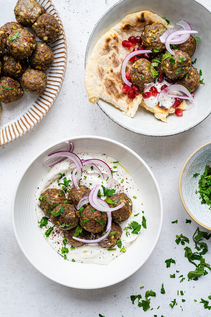 Lamb meatballs with naan and pomegranates