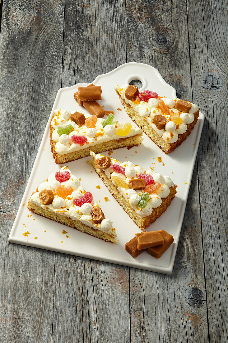 Orange and caramel cake decoration with fruit gums