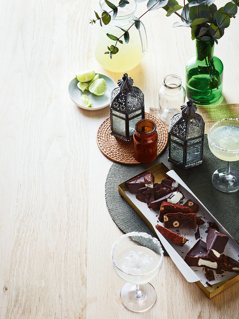 Chocolate cake and cocktails on a table laid for Christmas