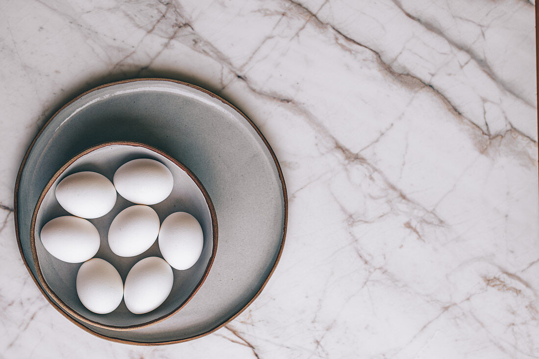 White Eggs in Bowl on Marble