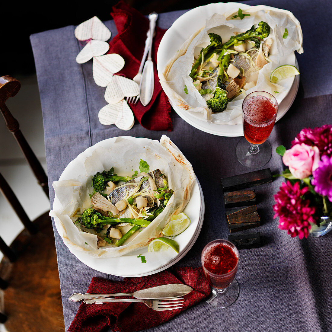 Fish en papillote with oyster mushrooms, broccoli and scallops