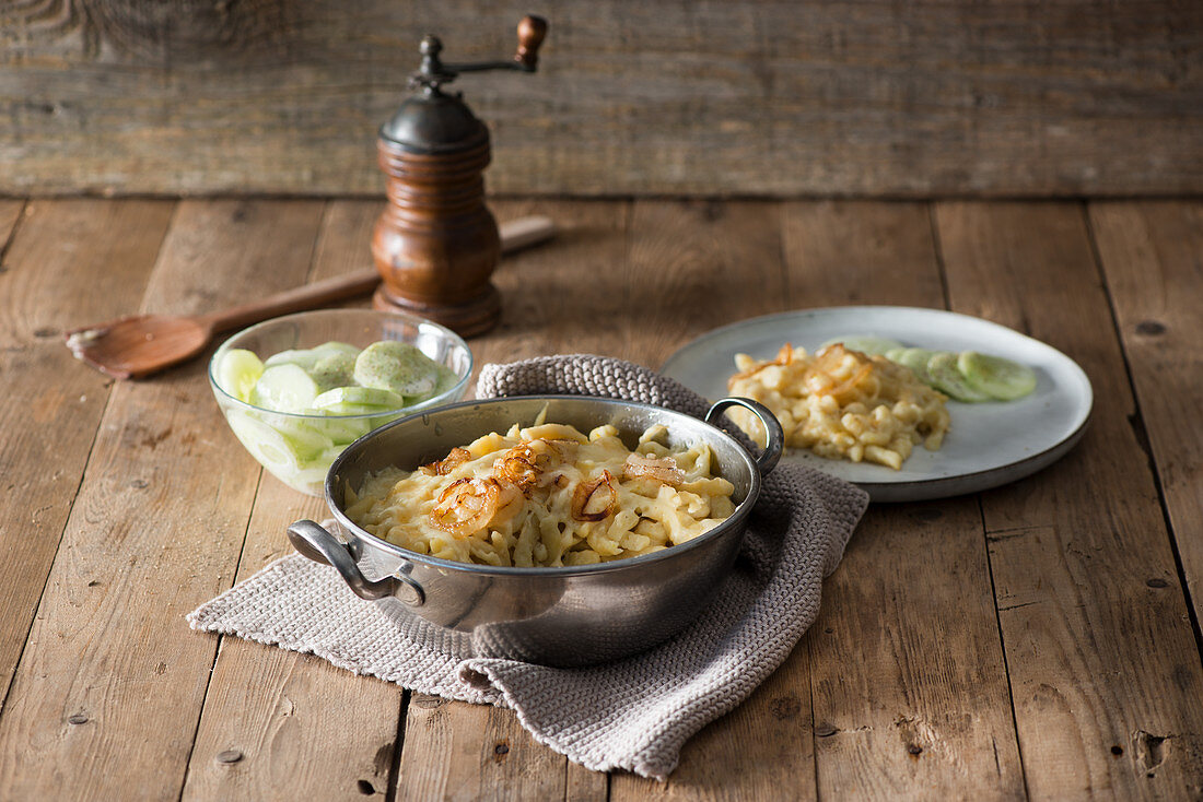 Cheese Spätzle (soft egg noodles from Swabia) with a cucumber salad