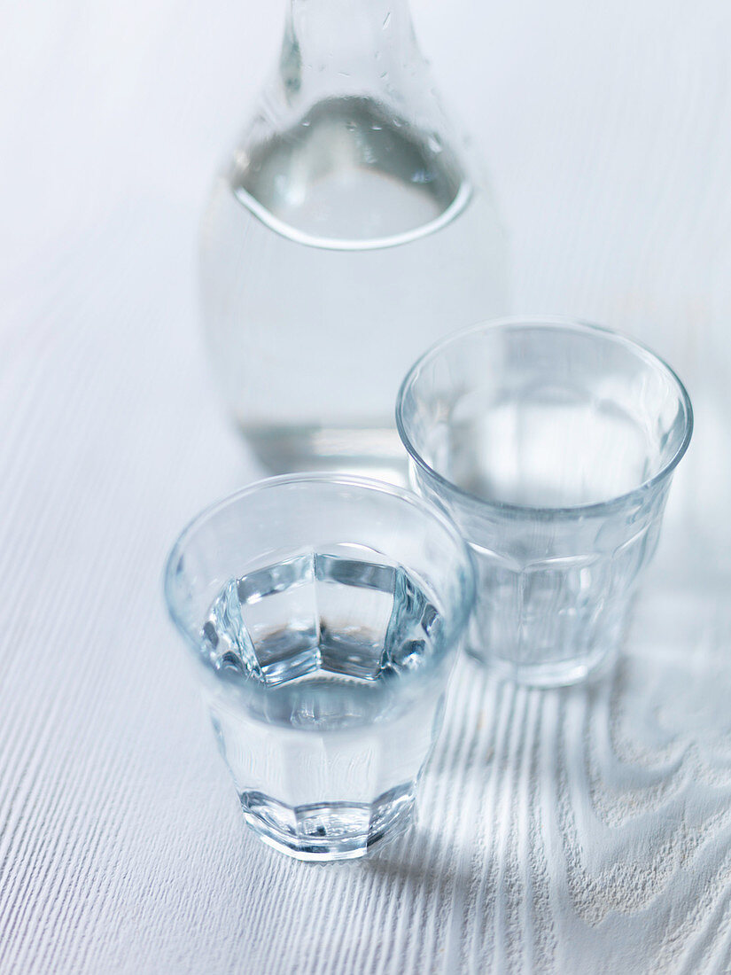 Water glasses on white wood