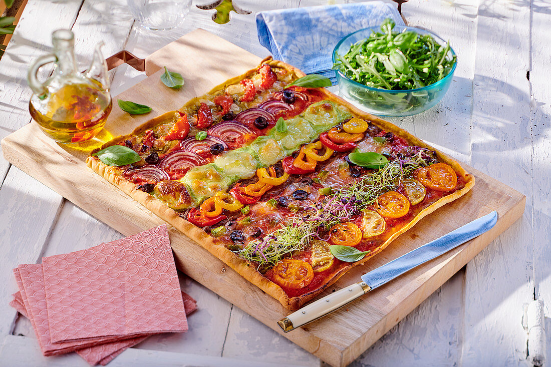 Rectangular vegetable pizza on a cutting board