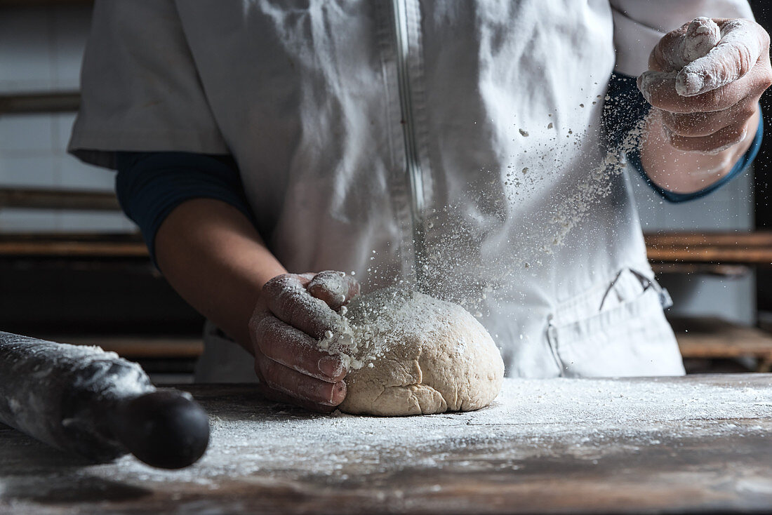 Dusting bread dough with flour