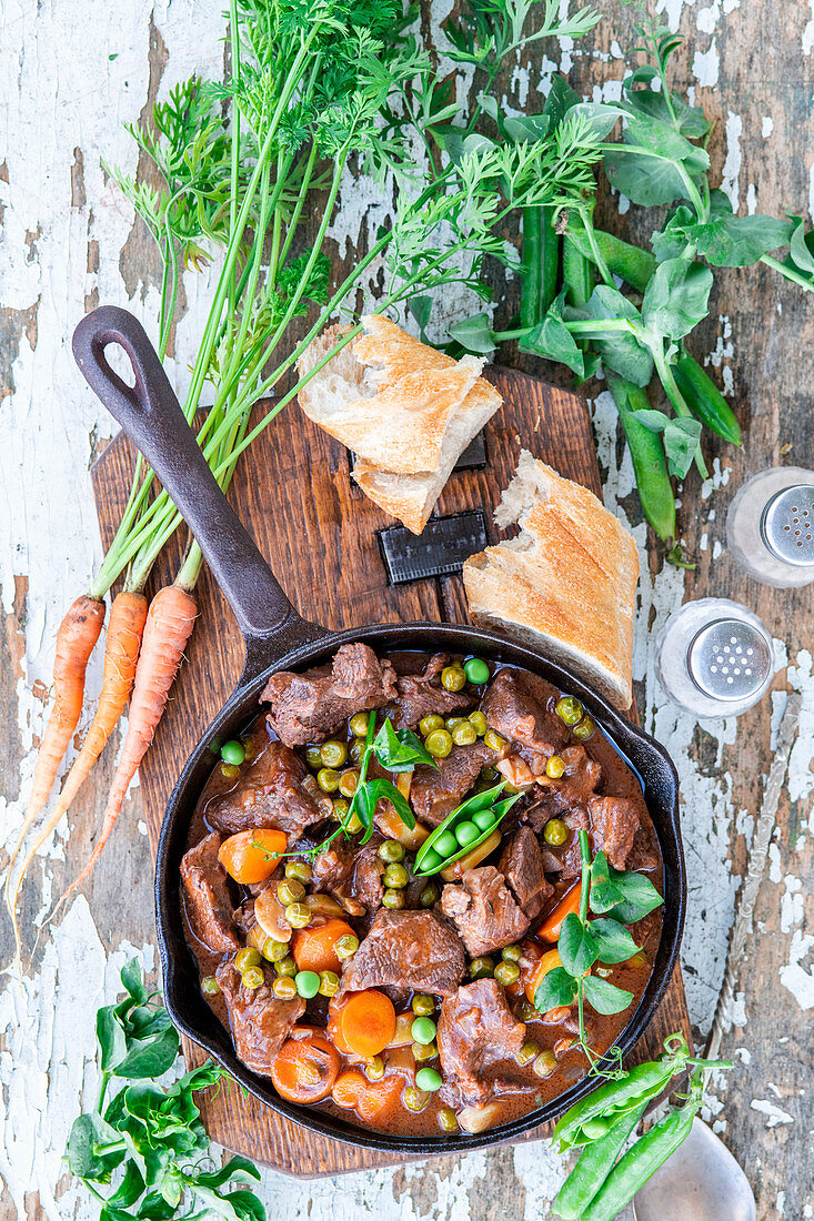 Beef stew with carrots and peas