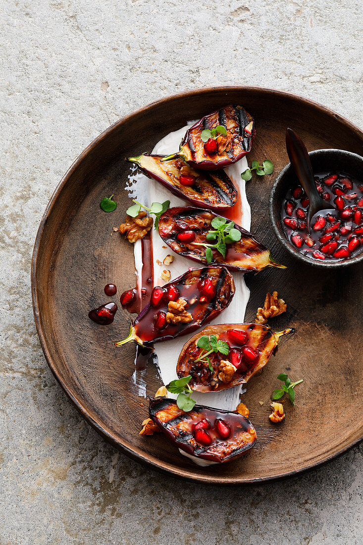 Mini aubergines with goat's cream cheese and pomegranate and honey syrup