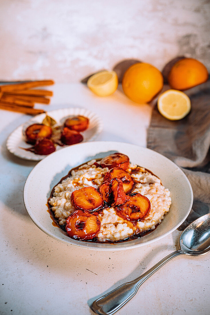Creamy cinnamon rice pudding with roasted plums