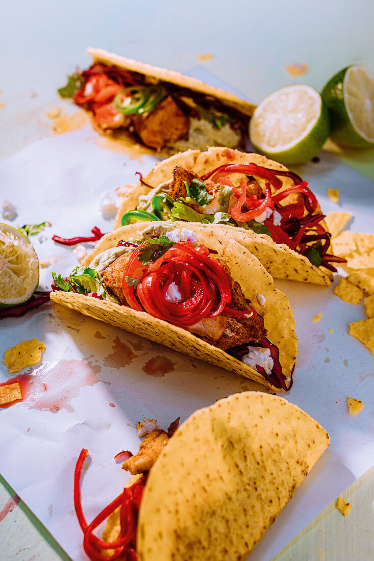 Spicy fish tacos with sour onions and coleslaw