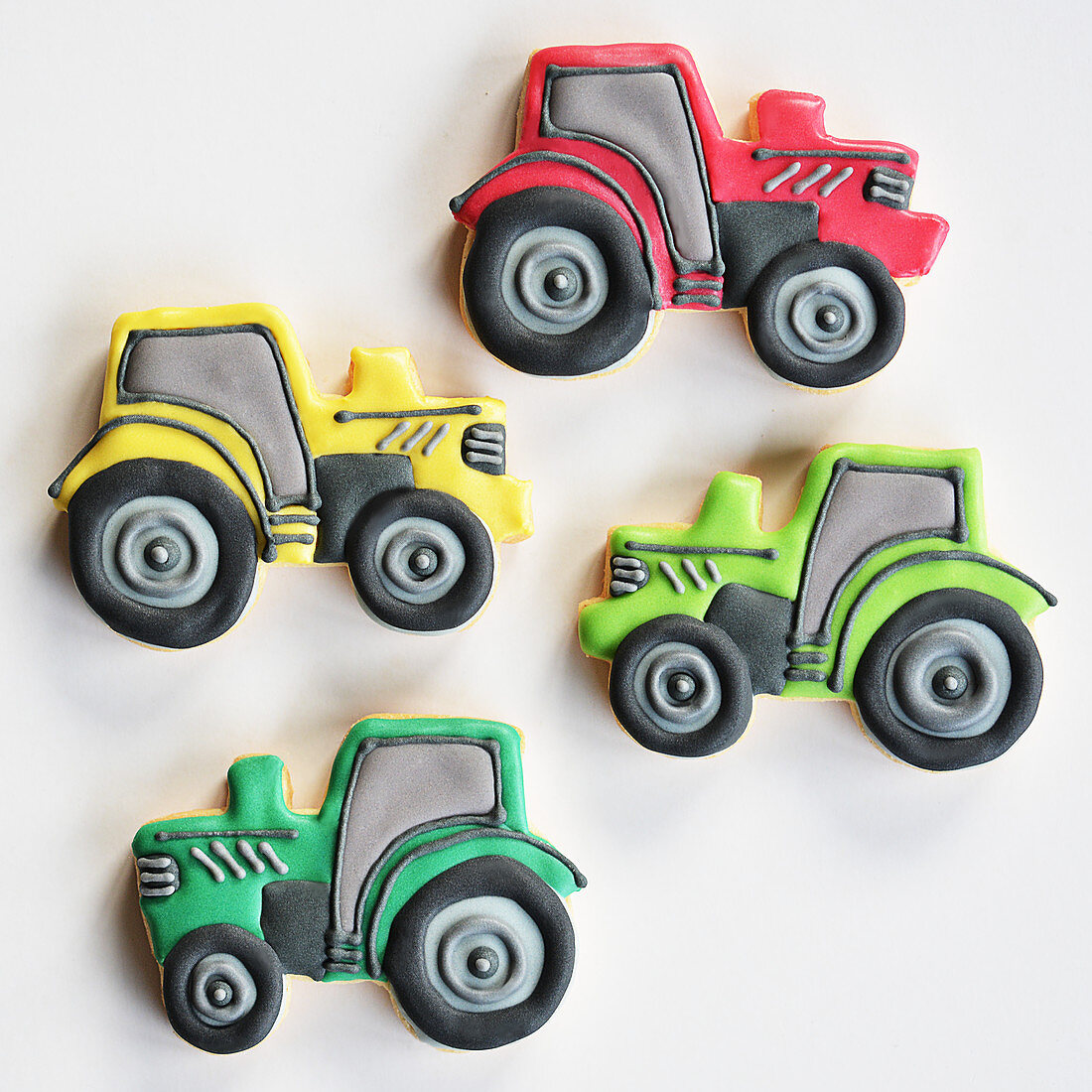 Colorfully decorated cookies in the shape of tractors