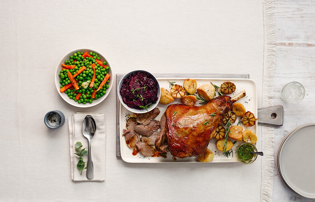 Roasted leg of lamb with various side dishes