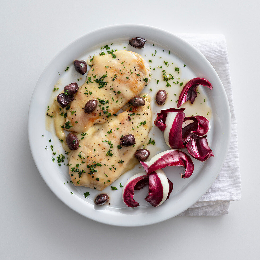 Chicken schnitzel with asiago and olives