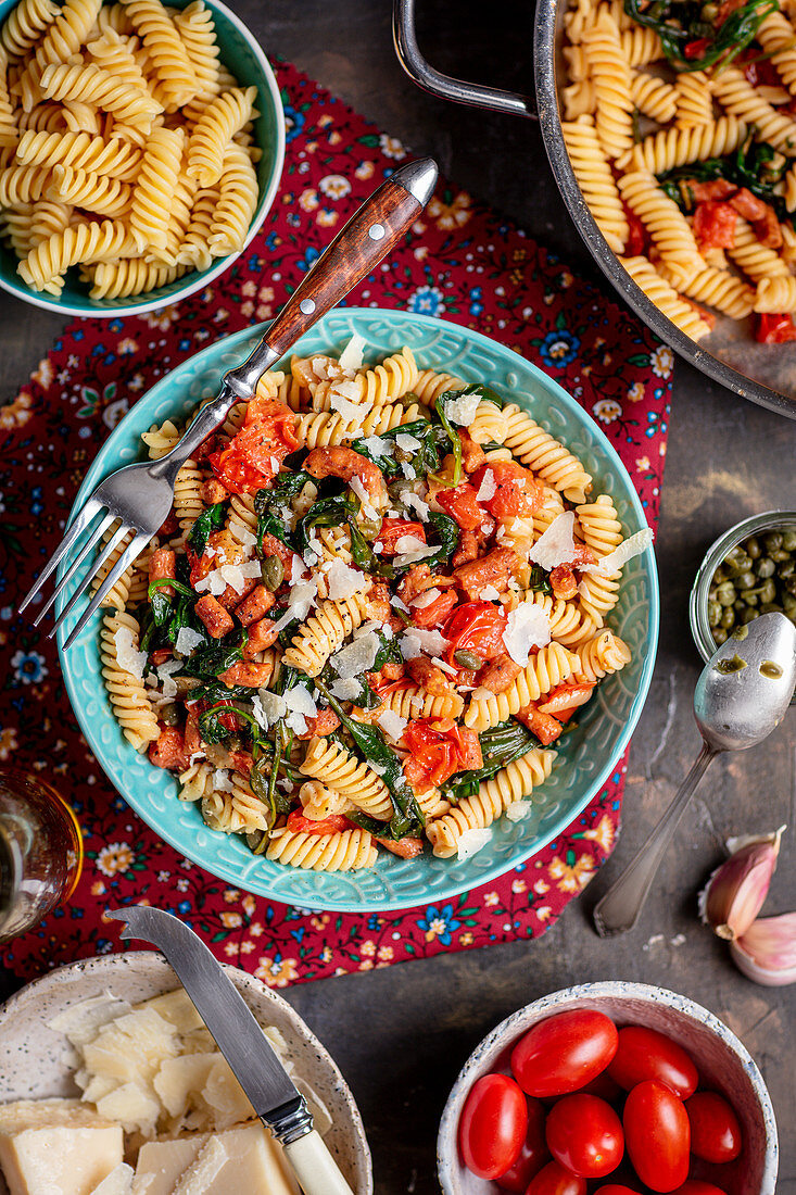 Pasta with sausage, tomatoes and spinach