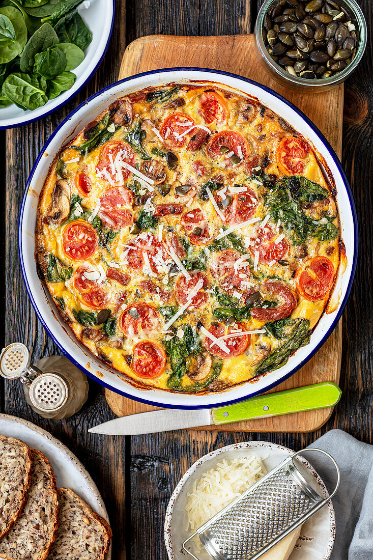 Frittata with sausage, spinach and cherry tomatoes