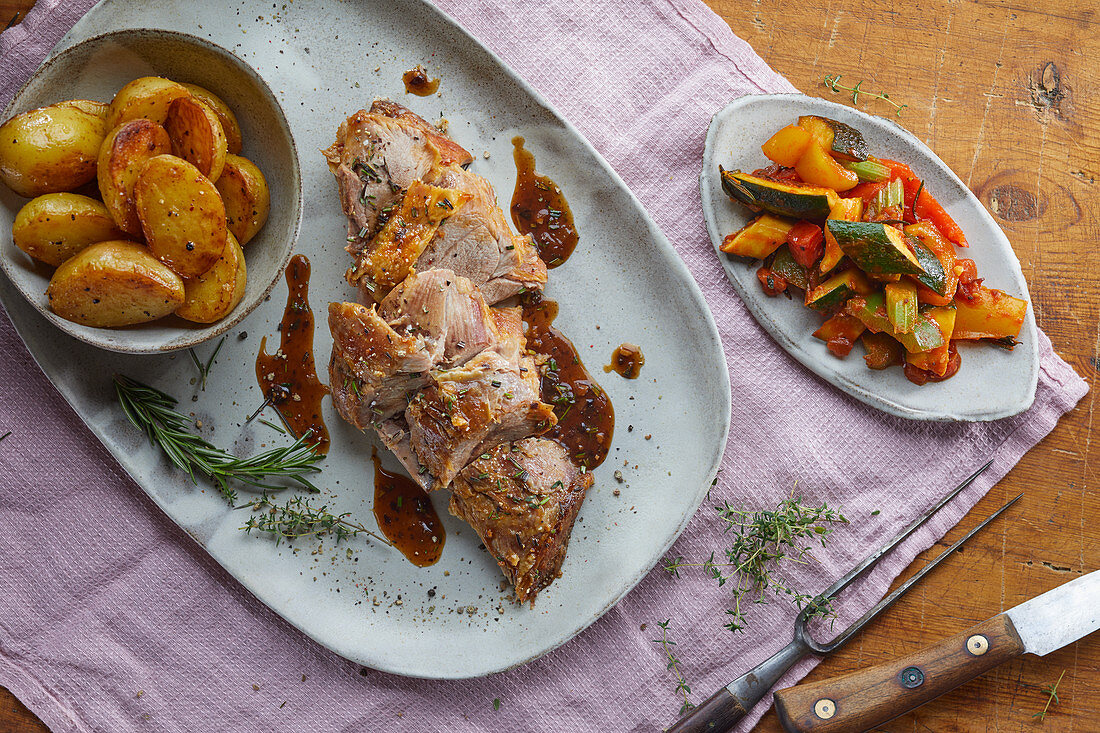 Roast lamb with fried potatoes and vegetables
