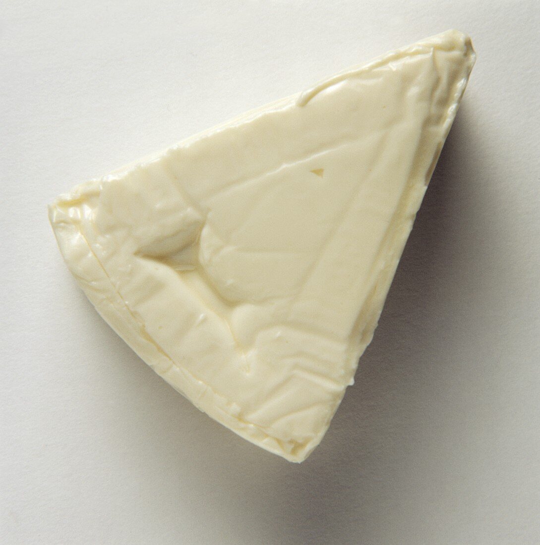 Commercially produced processed cheese triangle