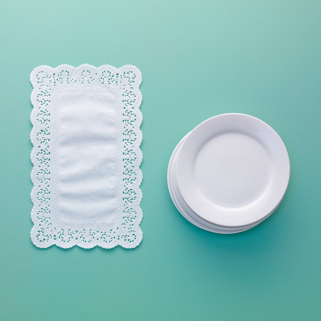 Doilies and a stack of plates