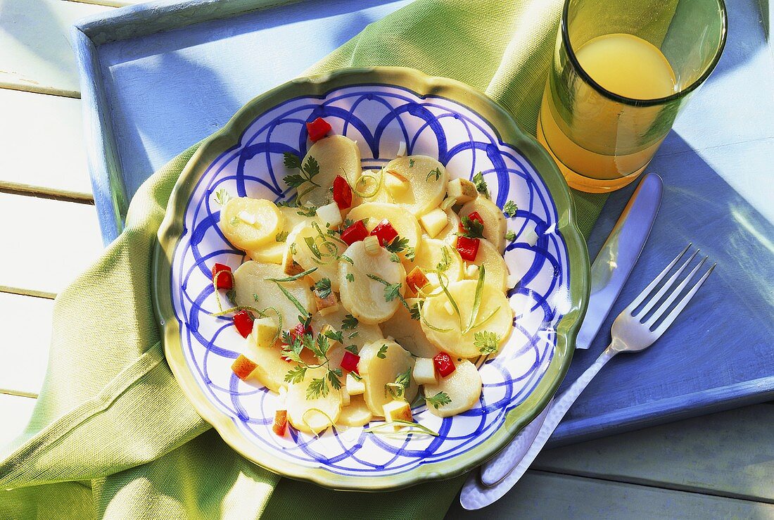 Potato salad with apple, pepper, herbs and lime zest