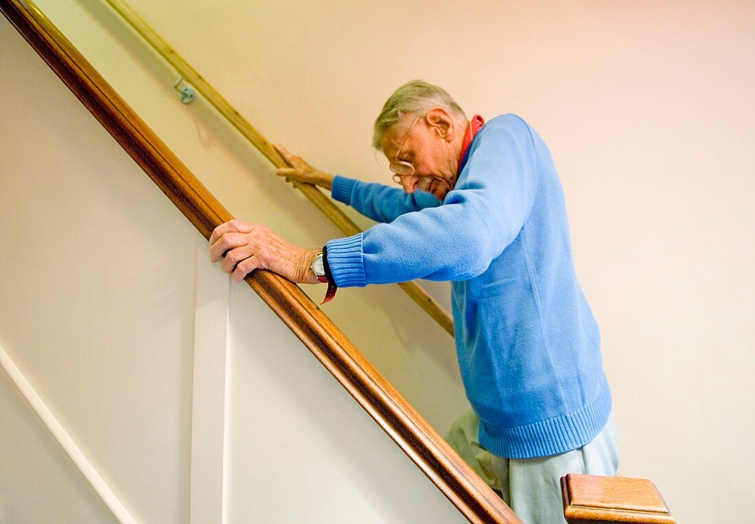 Elderly man climbing stairs
