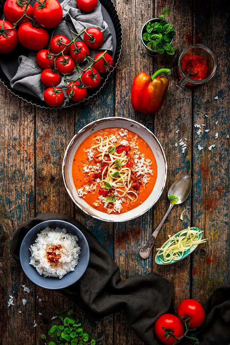Pepper and tomato soup with cheese and rice