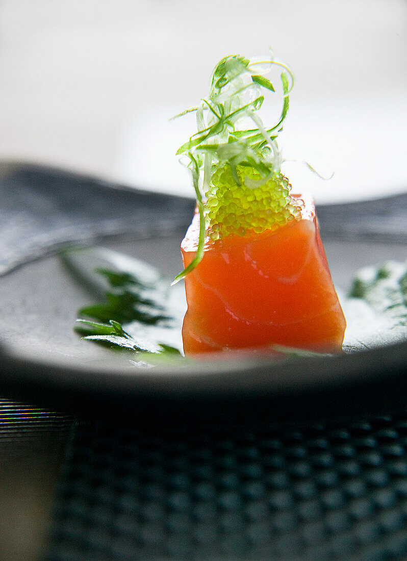 Salmon sashimi with green caviar
