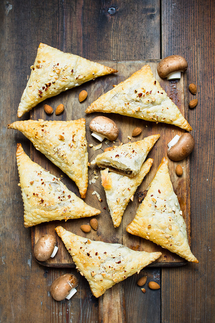 Vegan puff pastry pockets with mushroom filling and almonds